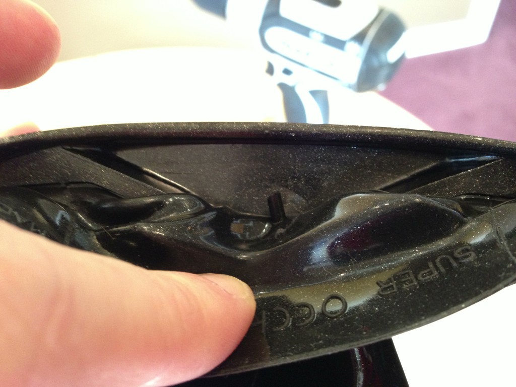 Peel back the mask's silicone skirt with your thumb while you drill