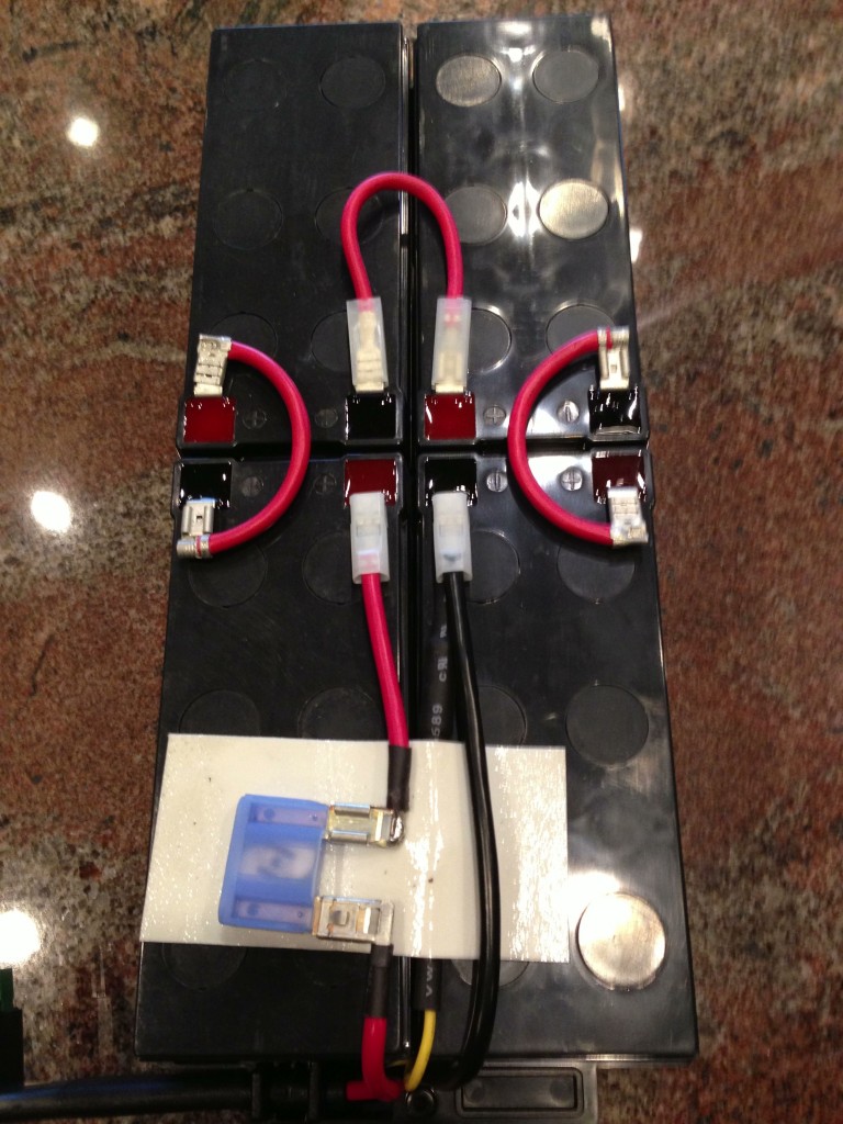 Take note of the wiring of the original batteries, then disconnect and remove the original batteries.