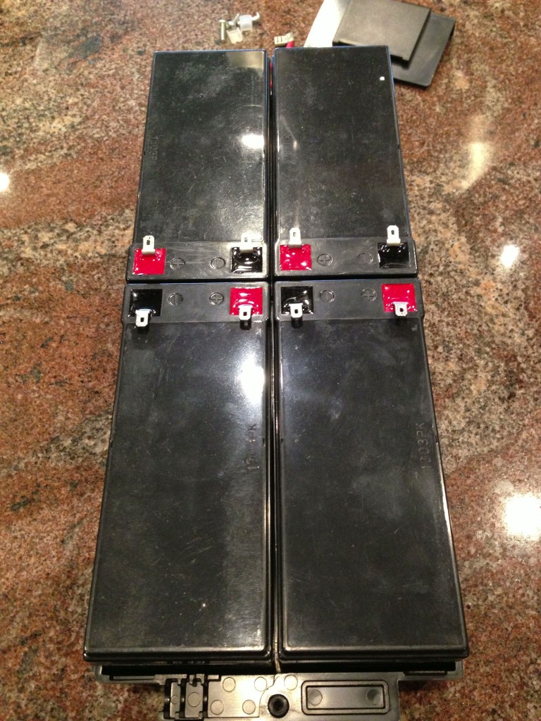 Install the new batteries in the base of the battery pack.