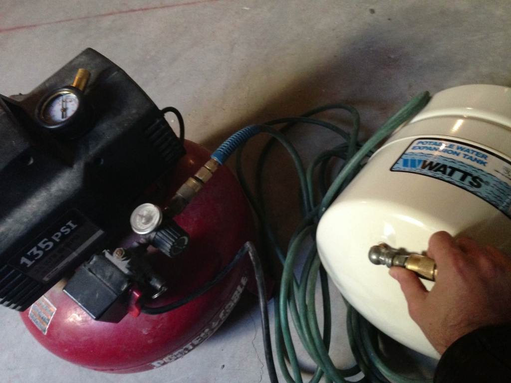 Adding air to the expansion tank with a compressor