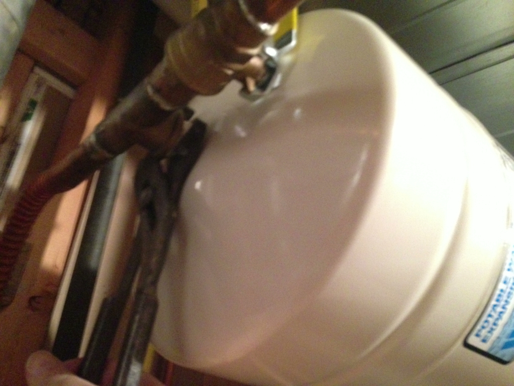 Tightening the new tank into place