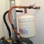 Main shutoff valve, cold water inlet, and expansion tank