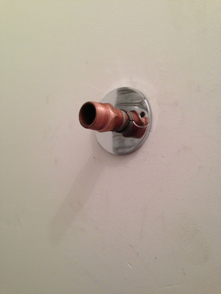 Cold water inlet sticking out of the wall