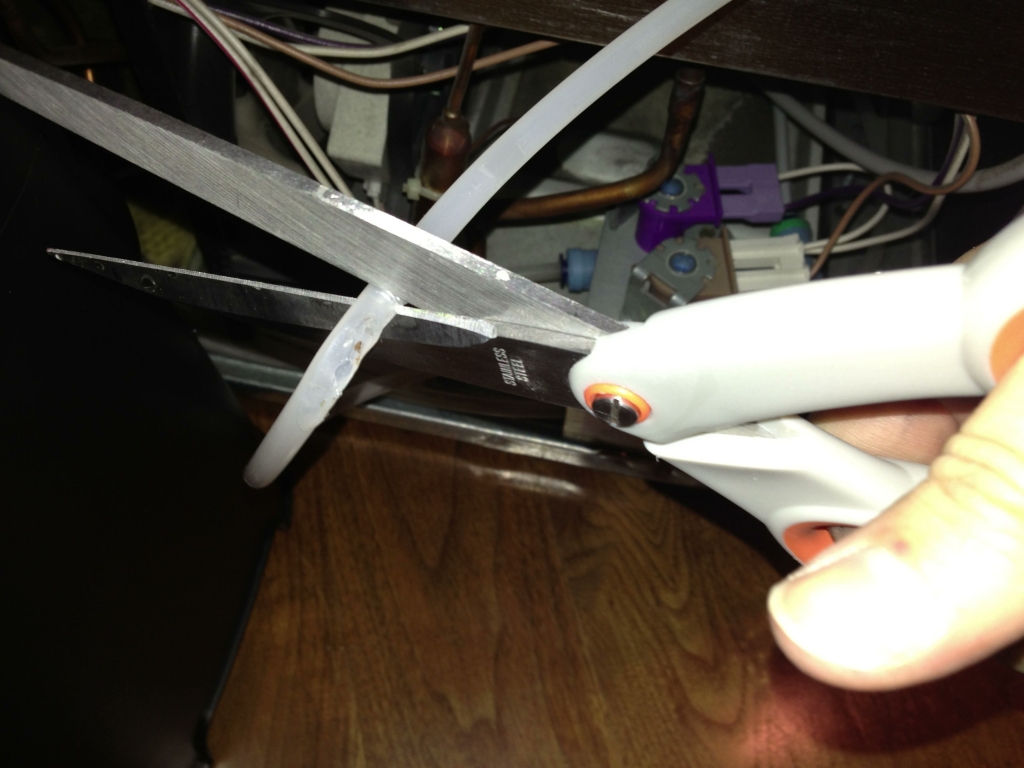 Cutting out the melted section of tube