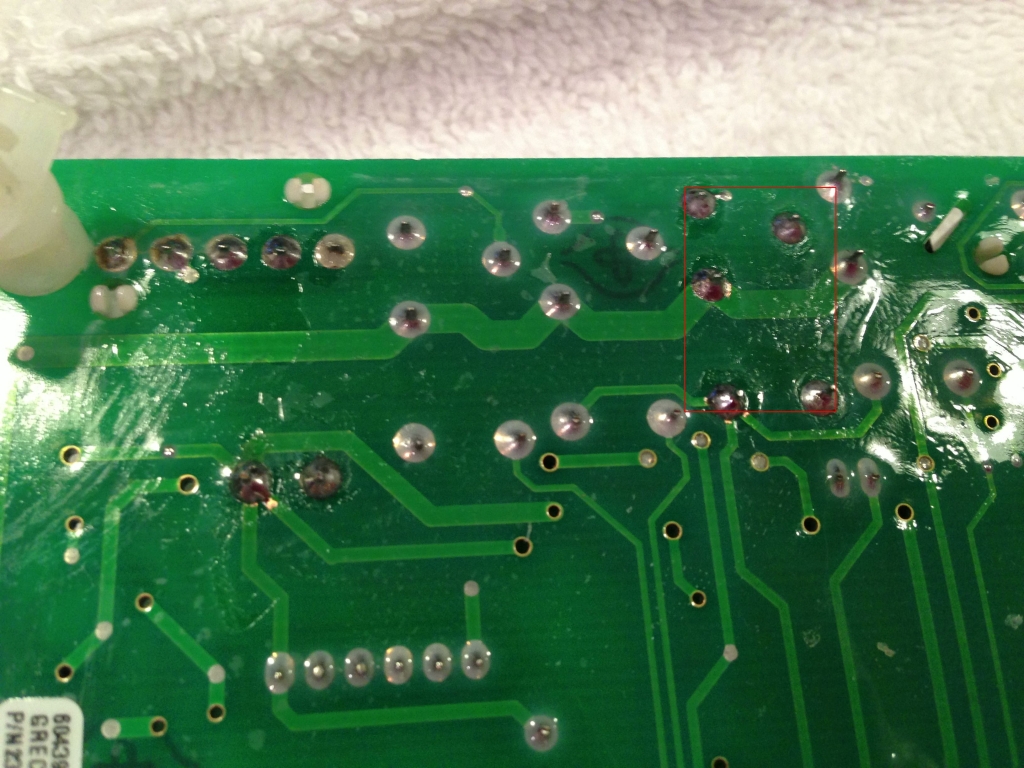 Five solder points for the relay are shown in red