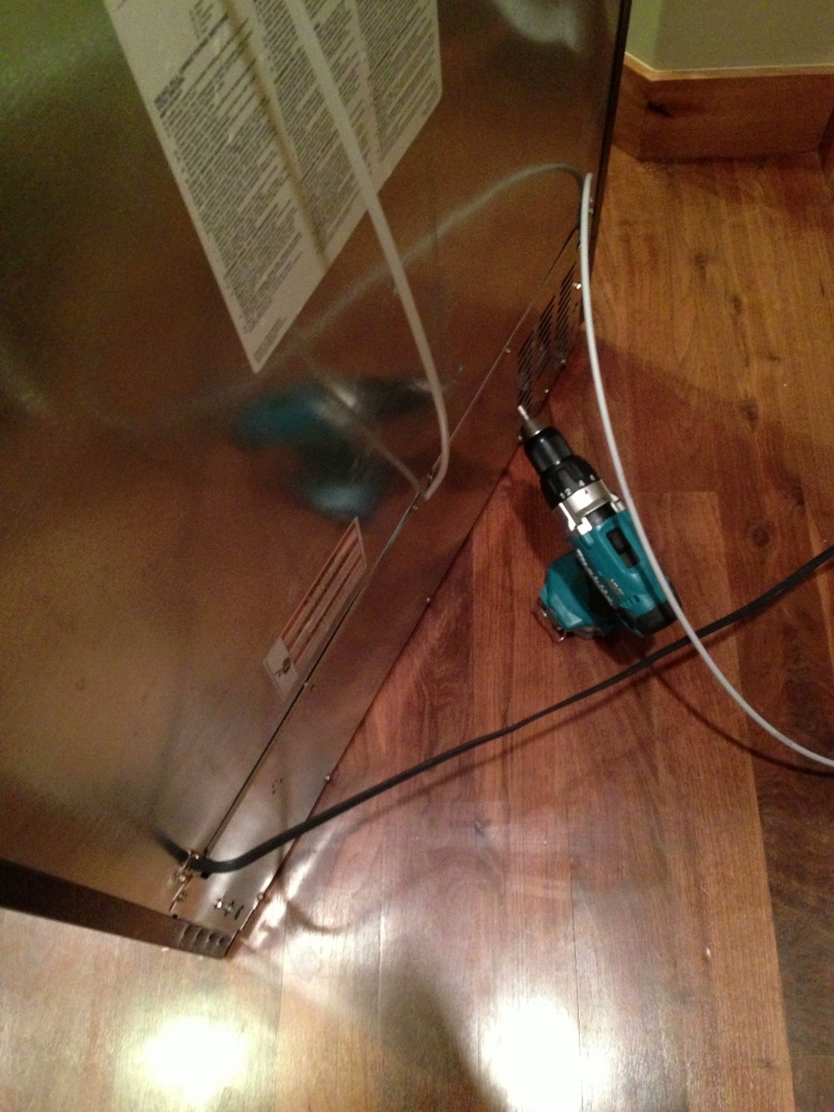 Removing the rear panel to access the condenser fan